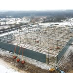 aerial shot of large pre engineered metal building under construction
