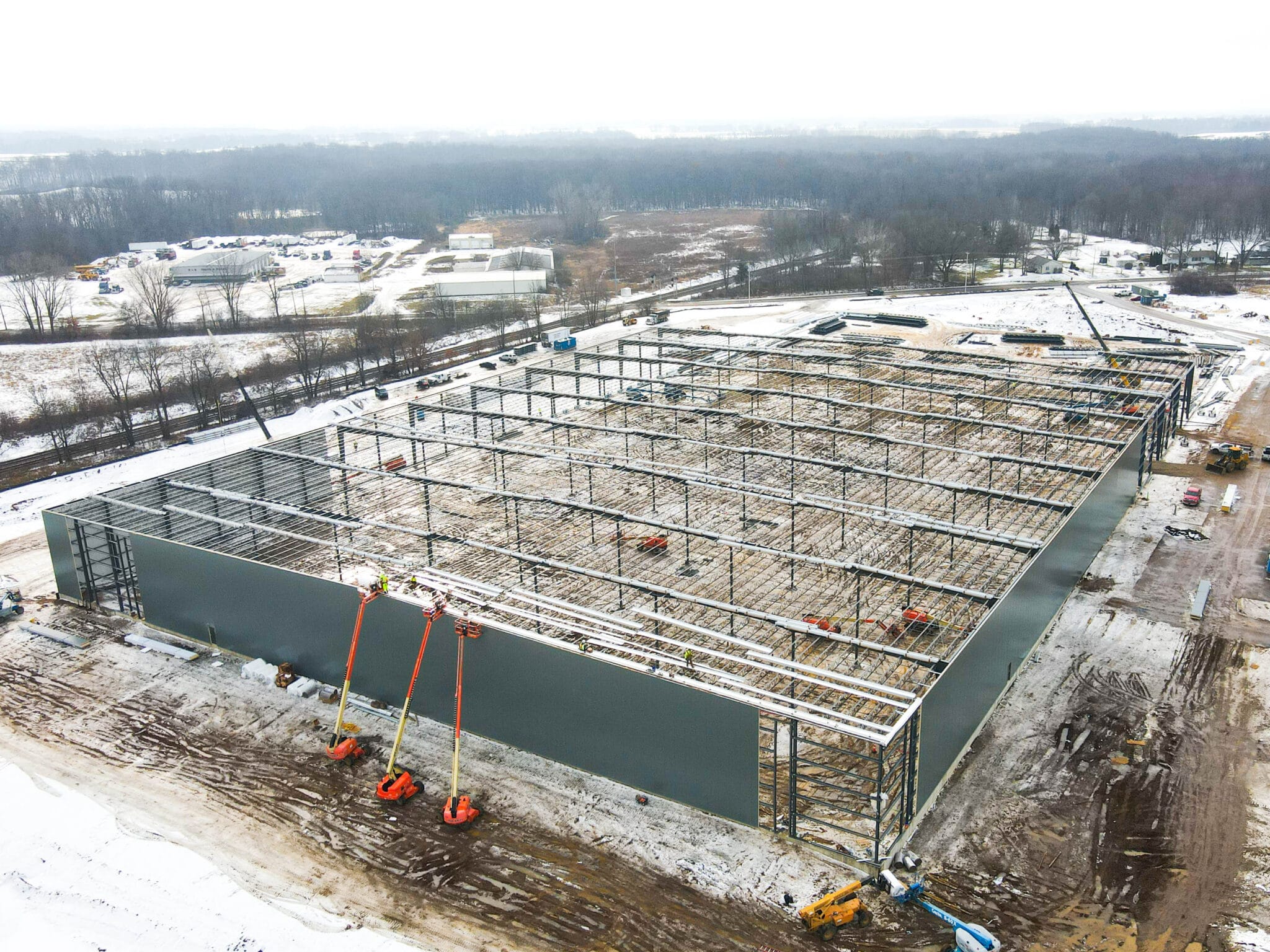 aerial shot of large pre engineered metal building under construction