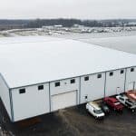 exterior of warehouse addition pre-engineered metal building for Dave Carter & Associates in Goshen Indiana