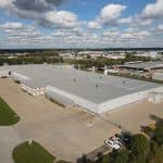 Aerial view of Crane Composites building on a sunny day