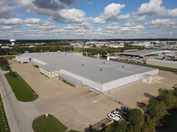 Aerial view of Crane Composites building on a sunny day