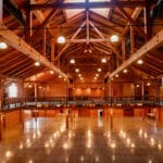 elegant open rafter event center with amish crafted wooden features view from balcony