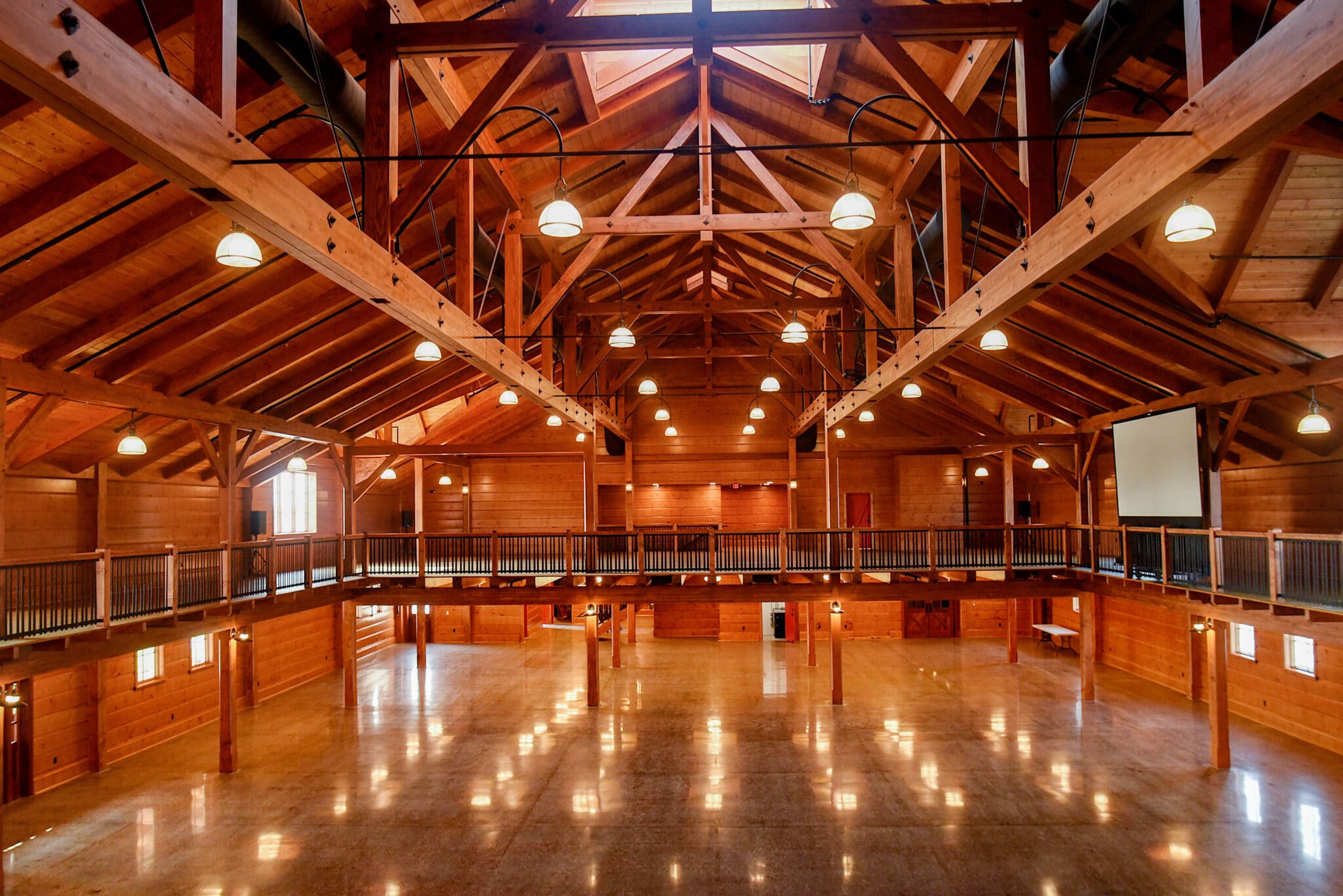 elegant open rafter event center with amish crafted wooden features view from balcony