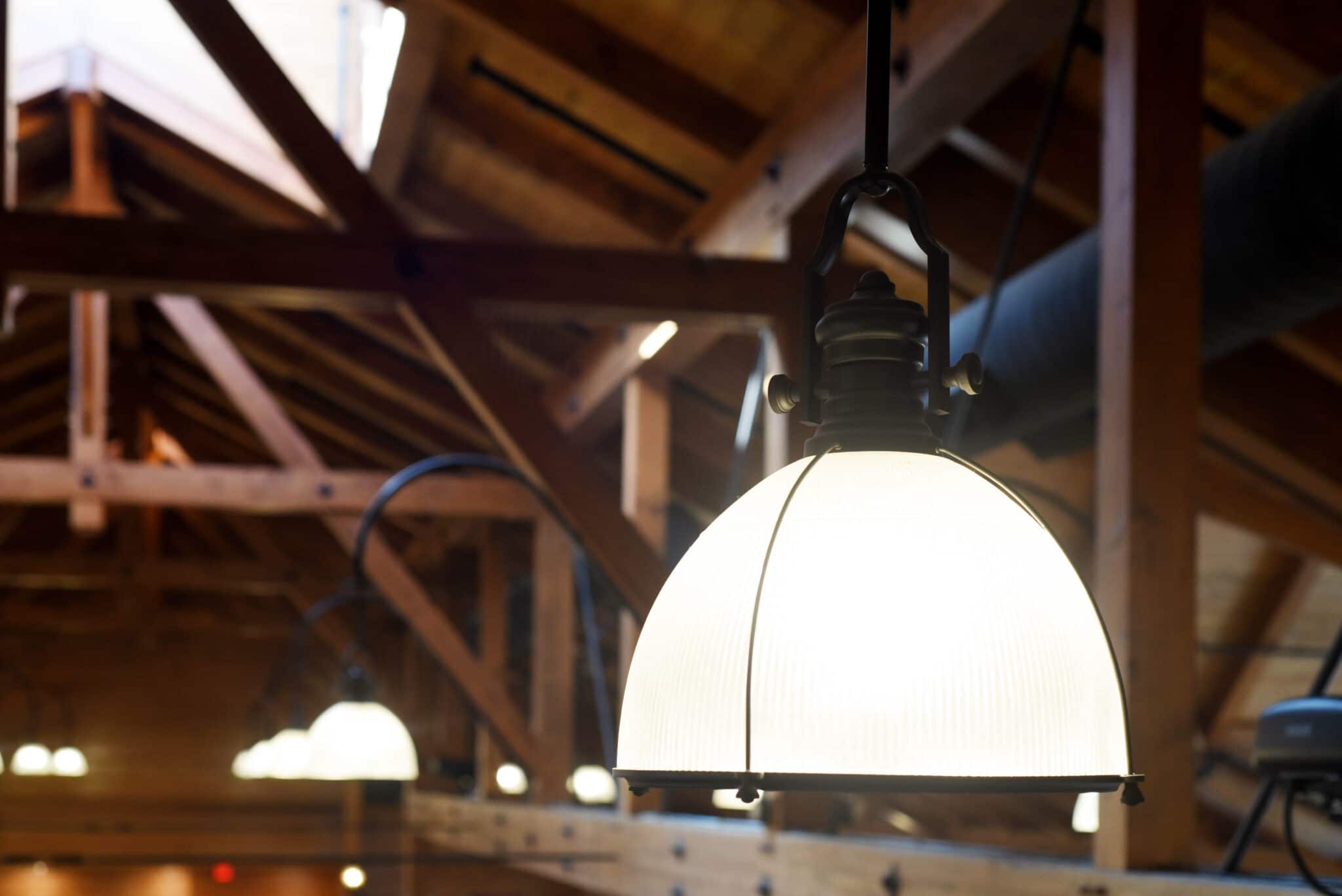 close up of light fixture on amish-crafted wooden structure