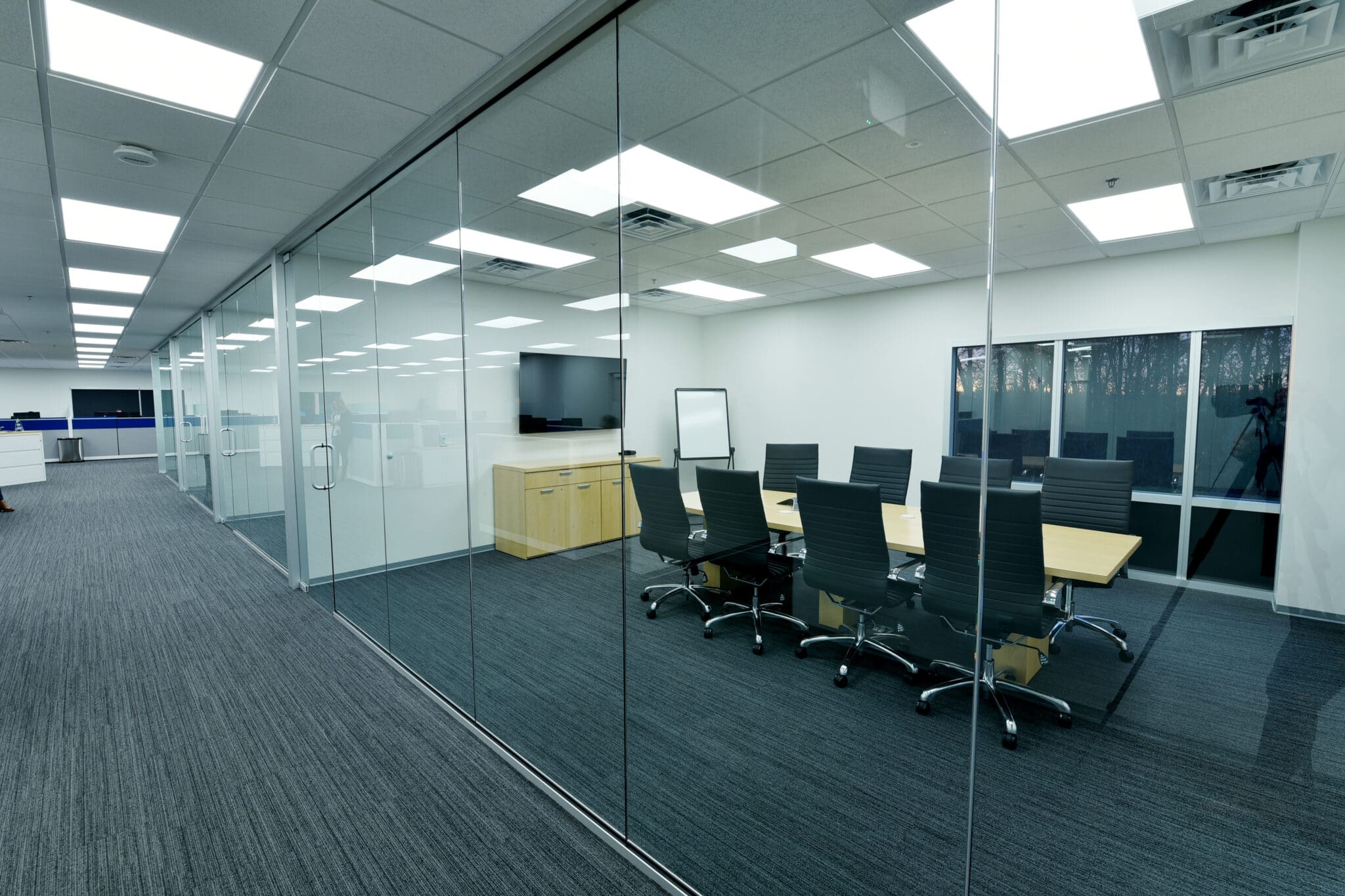 sleek and elegant glass-walled conference room