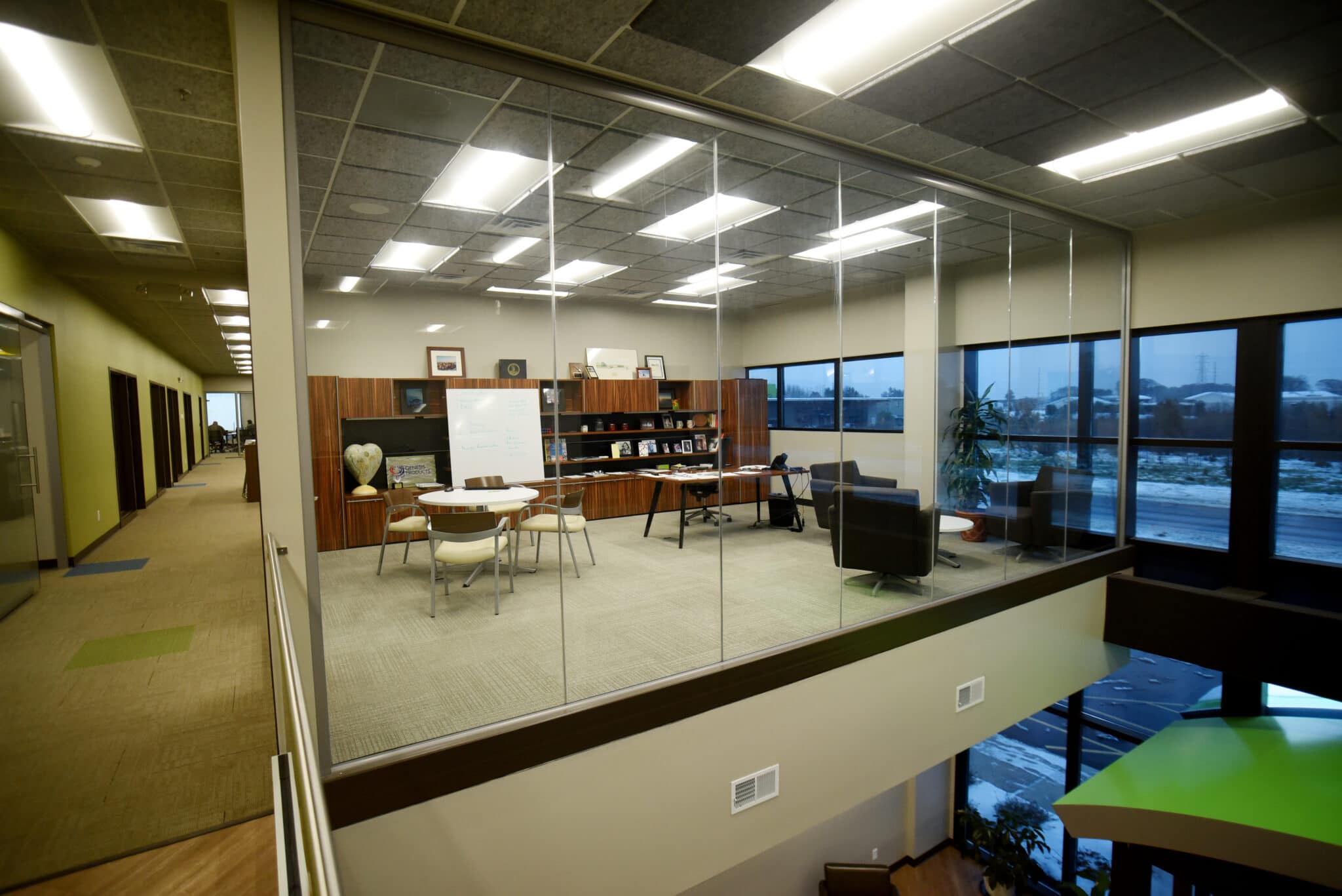 spacious glass-walled second floor office at Genesis Products