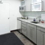 View of small clean office kitchenette