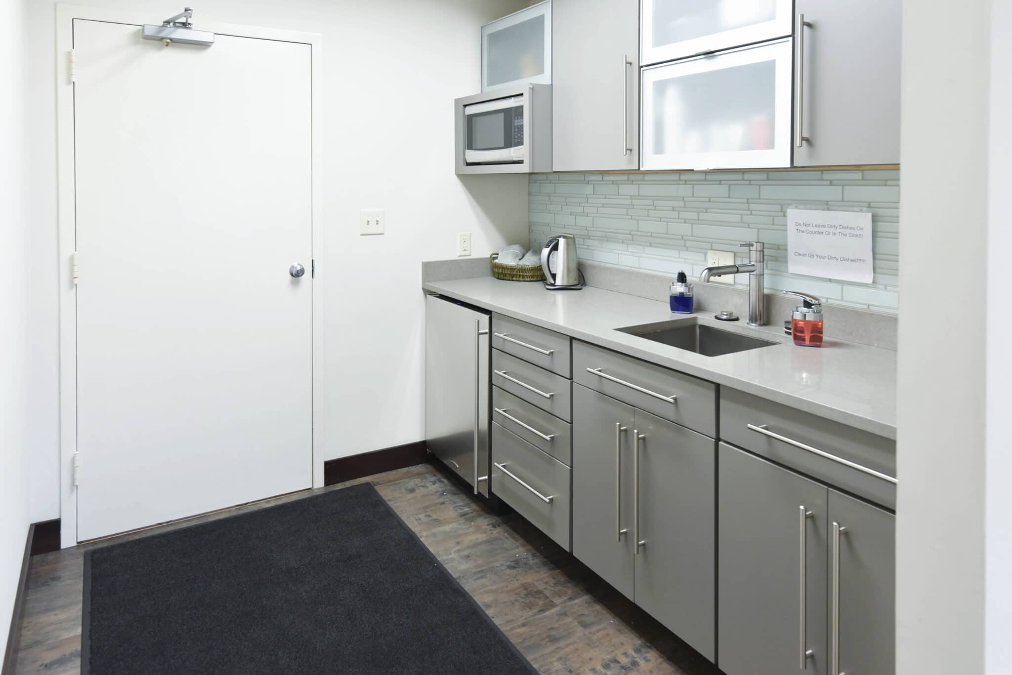 View of small clean office kitchenette