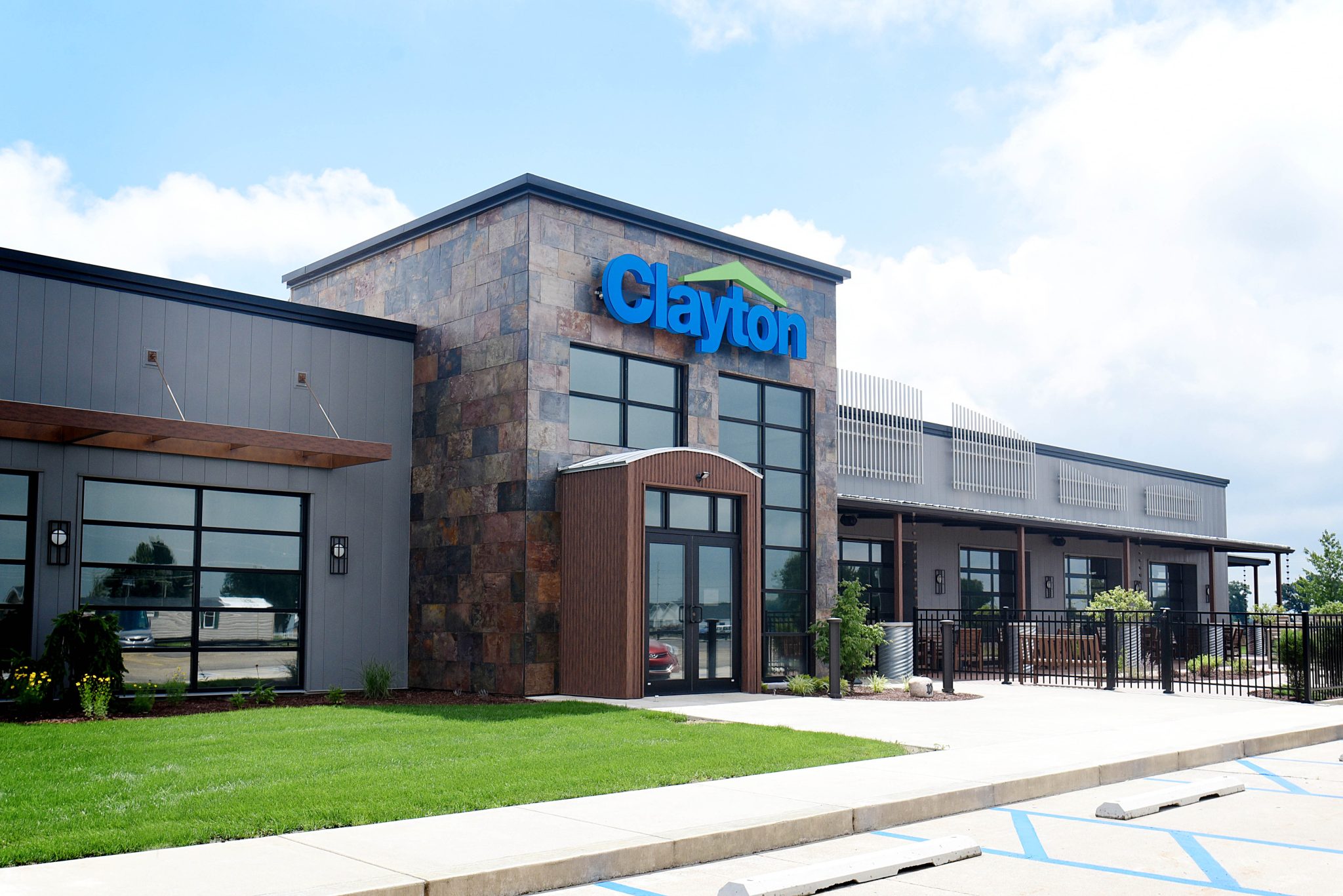 exterior shot of renovated Clayton Homes location on sunny day