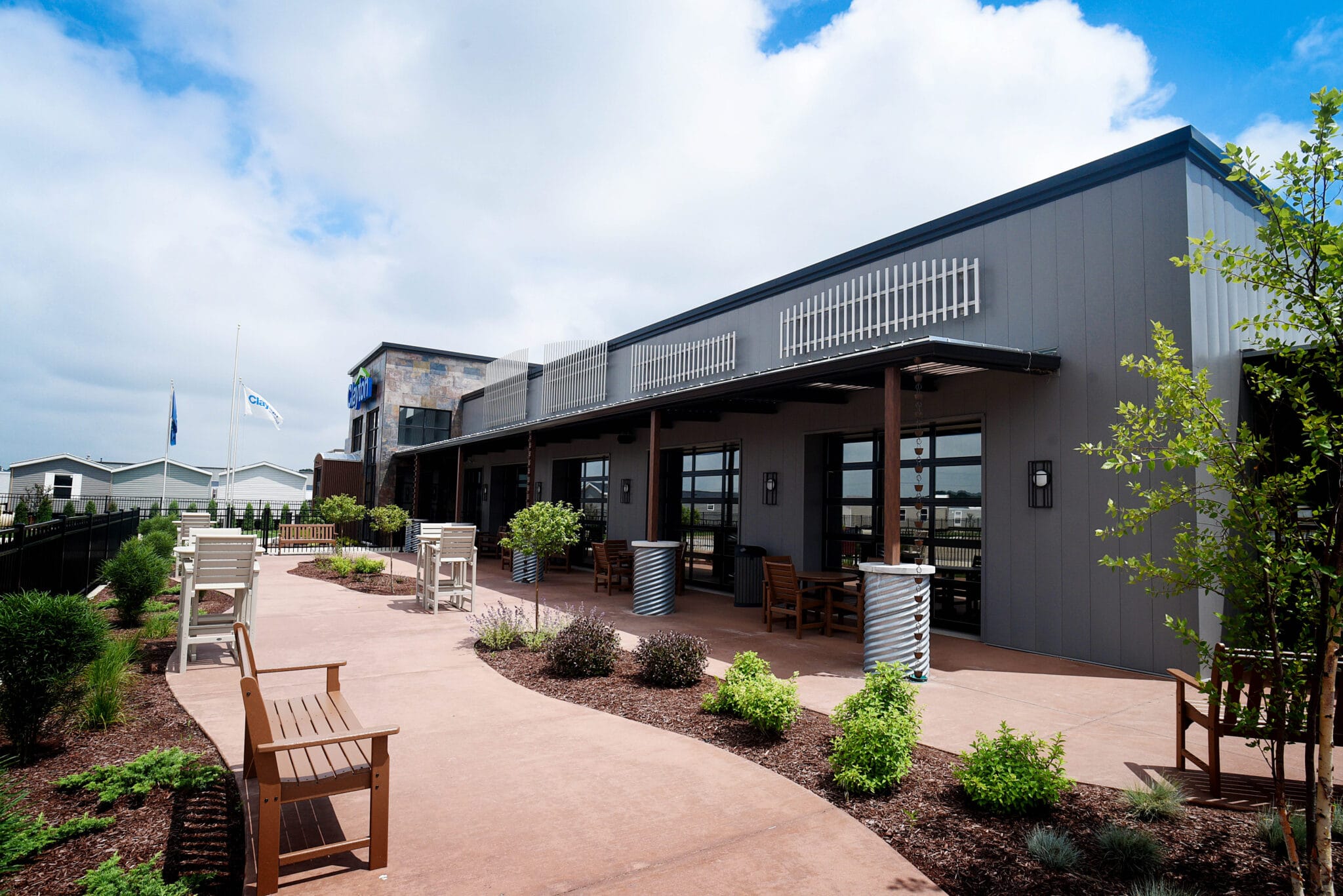 beautiful sunlit office patio with benches and landscaping