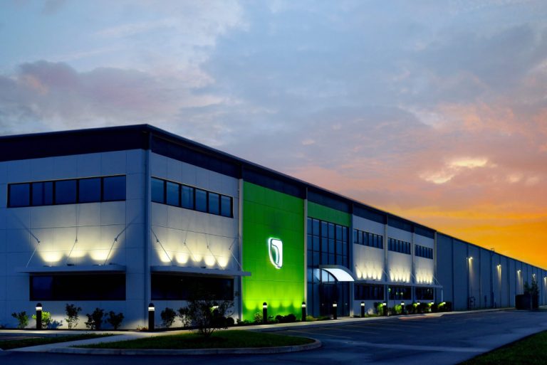 exterior view of Genesis Products building at sunset