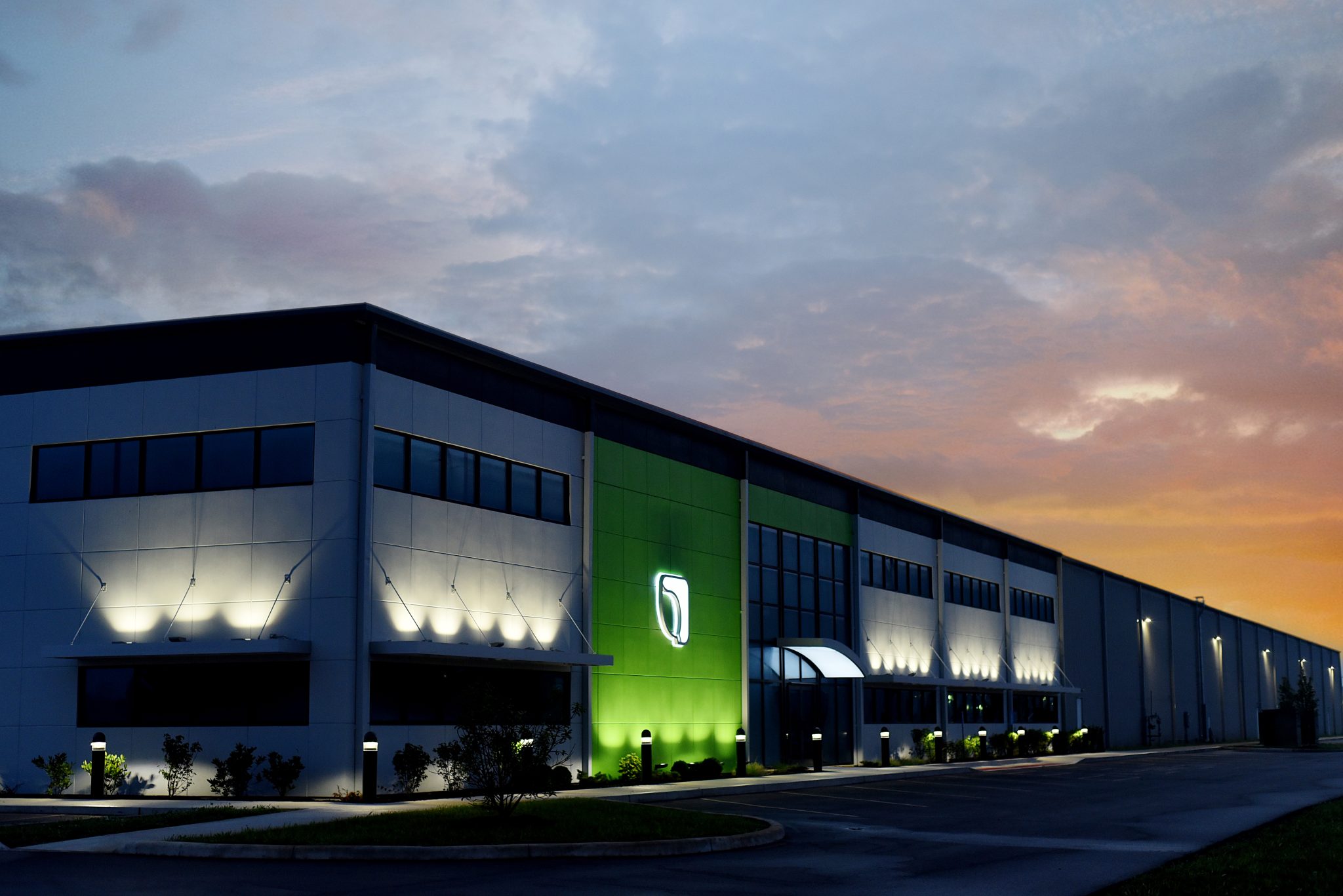 Exterior shot of Genesis Products building at dusk