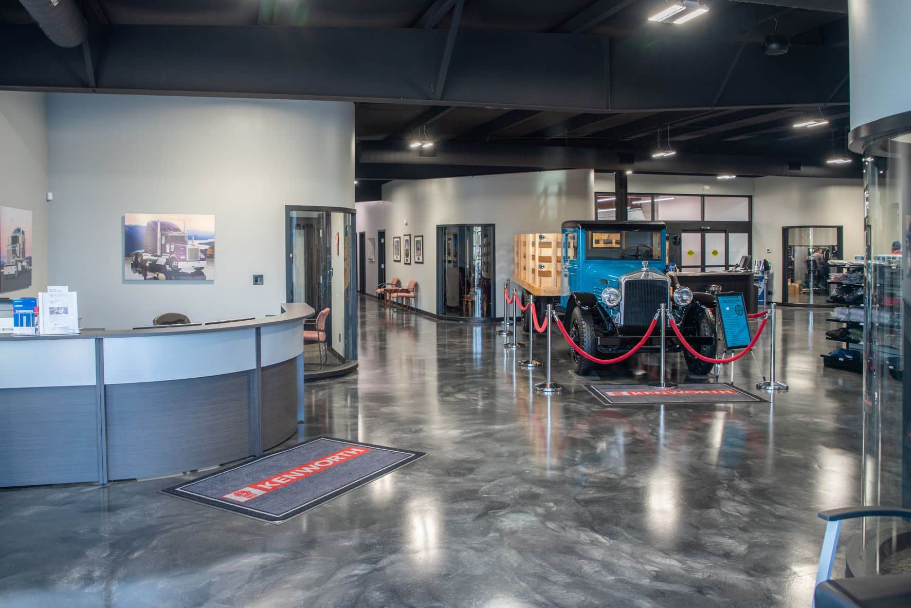 Whiteford Kenworth showroom with welcome desk and old delivery truck on display