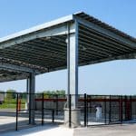 solar canopy at Whiteford Kenworth Toledo outdoor fueling or wash station with black fencing. metal building constructed by nuway construction